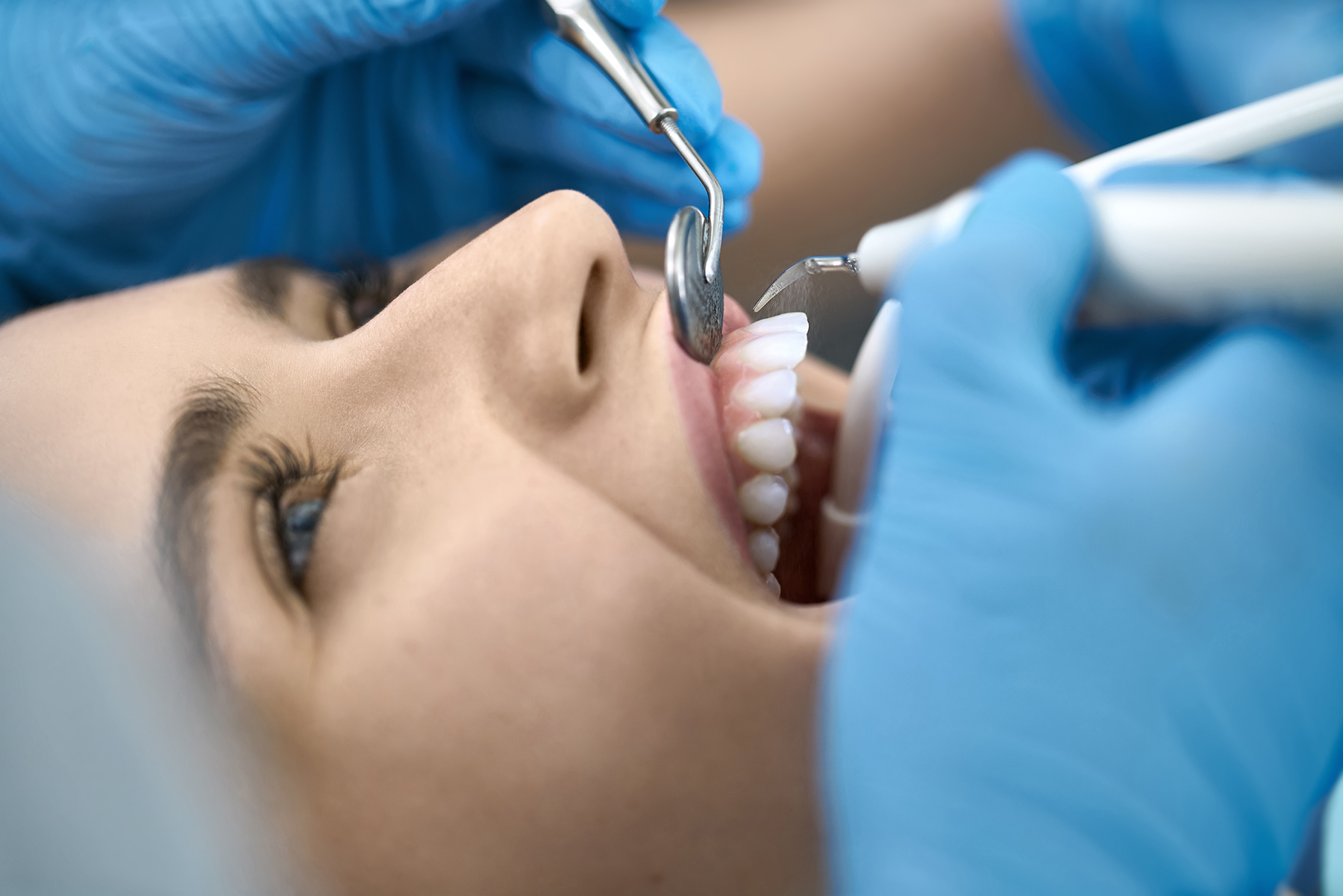 Woman getting a dental cleaning in Ridgeland, MS